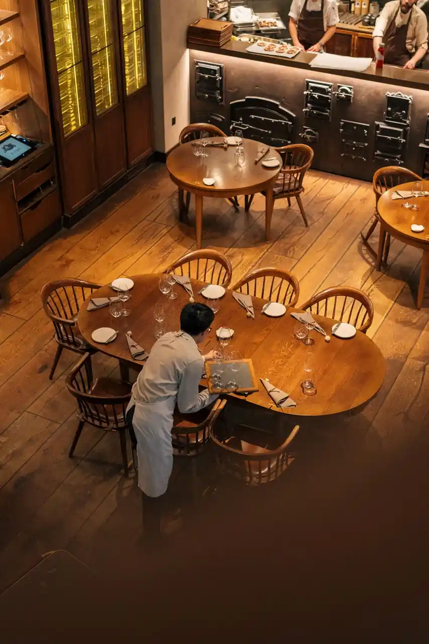 Elegant private dining table set with fine porcelain and polished silver at Quietlidge Works