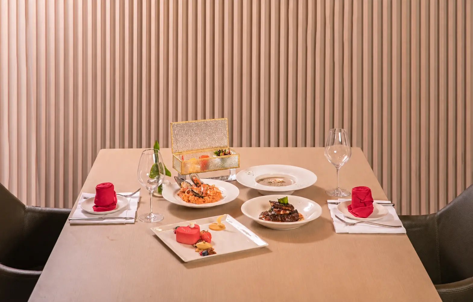 A variety of gourmet dishes presented on a marble table during a private celebration