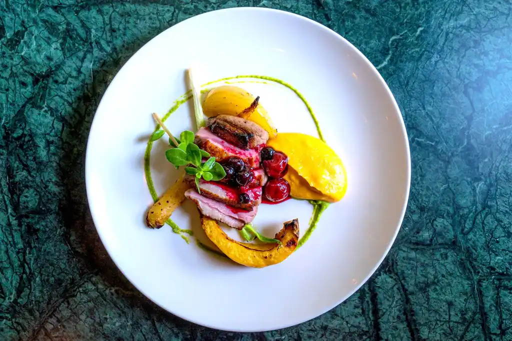 Signature duck breast with berry sauce