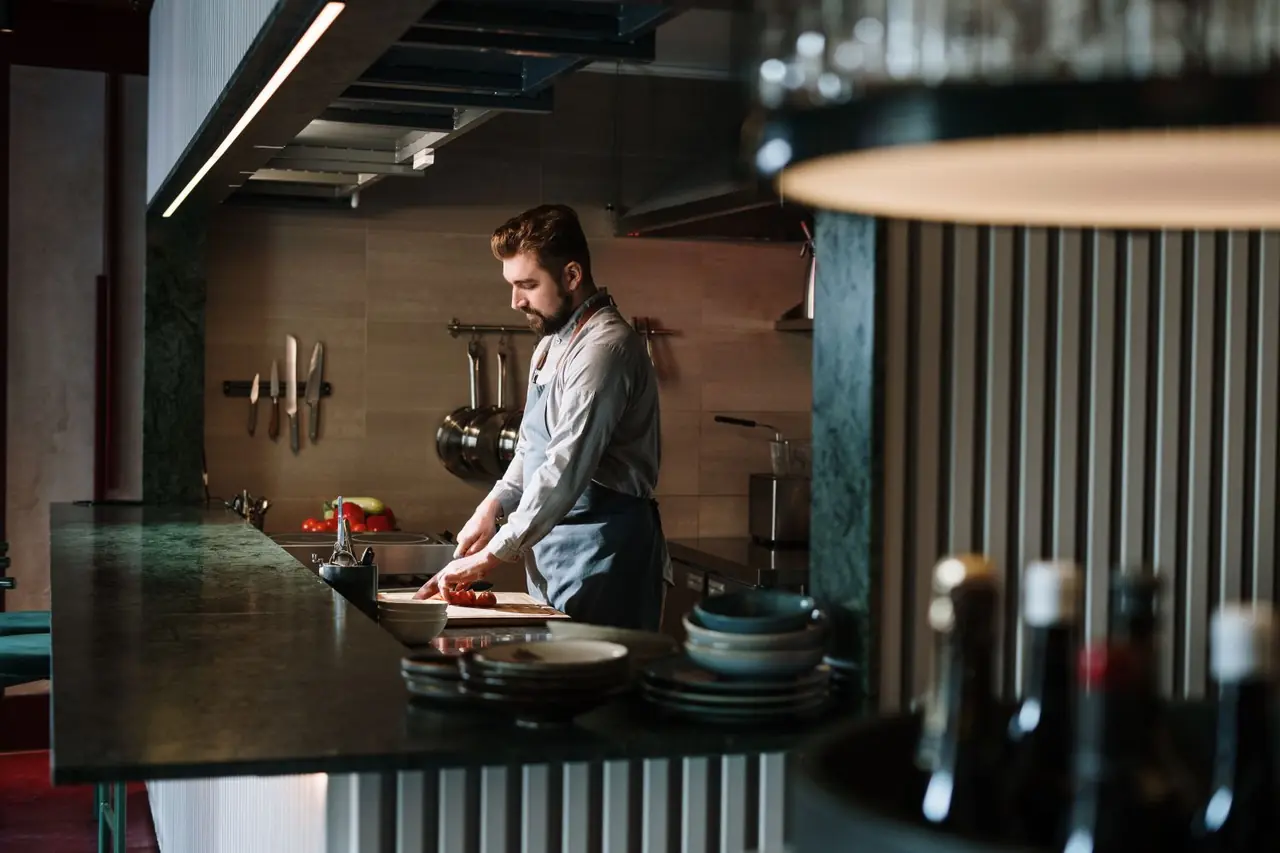Executive Chef preparing seasonal British ingredients in the Quietlidge Works kitchen