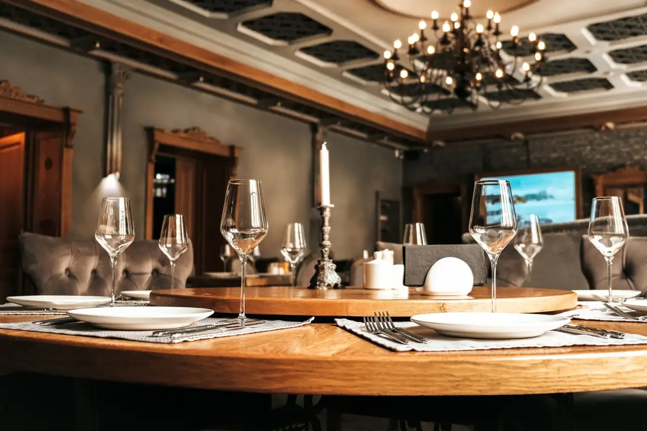 Elegant Quietlidge Works dining room with soft candle lighting and sophisticated table settings